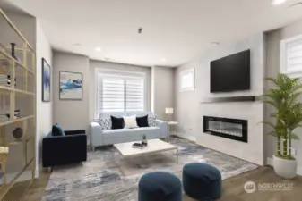 Virtual staging.  The family room offers a wall mounted TV location, surround sound in the ceiling, and an electric fireplace for ultimate enjoyment.