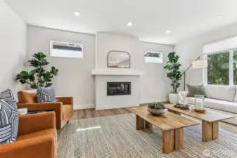 Huge great room with large windows, LVP Flooring throughout main level, cool textured tile surround gas fireplace, Smurf tube ready for TV/Cable.  Perfect for large gatherings or snuggle up around the fireplace for a nice read or to watch TV.