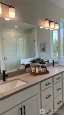 Primary bath.  Gorgeous quarts, dual sinks, spacious cabinets and drawers. Large linen, walk-in closet and separate water closet.