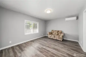 Primary bedroom with mini split to keep cool in the summer or extra warm in the winter.