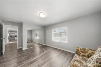 Primary bedroom with all glass closet doors..