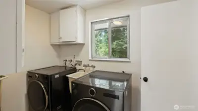 Laundry Room that's big enough for two full-sized washer and dryer.