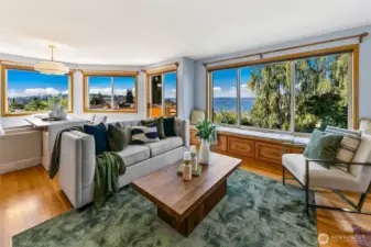 Main living room has walls of windows to soak up the sun and views.