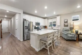 Open and bright with a walk in pantry the oversized island offers plenty of eating and cooking space.