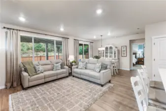 Large windows let in plenty of light off the covered patio and the beautiful, easy to care for LVP offers a lovely backdrop for all your furnishings.