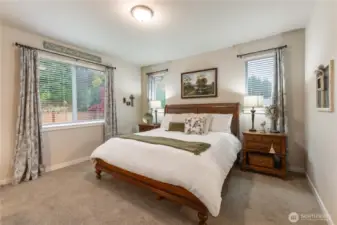 Large primary bedroom is privately located and has plenty of room.