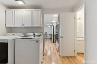 Storage and 1/2 bath in this laundry room.