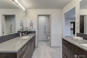 Double vanities, double shower heads, towel warmers, heated floor