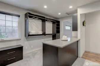 dressing closet then leads back out to the primary entry