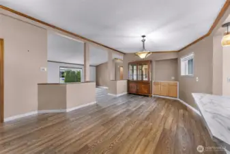 Off the kitchen is the formal dining area, with custom built ins and additional buffet area