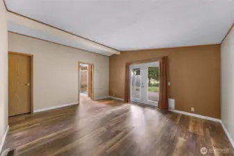 Large primary bedroom with private access to covered back porch.