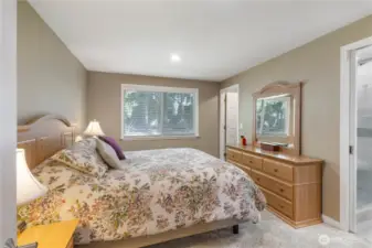 Primary Bedroom window faces rear of home.