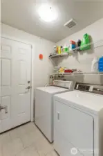 Utility room with Speed Queen W/D just inside entry from garage.