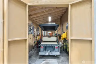 Handy Golf cart garage is attached to the cabin. All vehicles are electric/battery powered. There are a few gas vehicles for rent at the clubhouse if you need to bring large loads up or good, etc.