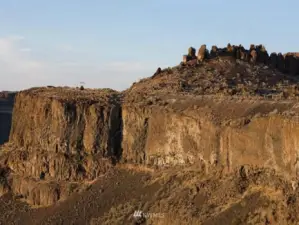 Stunning cliff vistas.  400 foot shear cliff walls to canyon floor below. Head of Frenchman Coulee has 50 developable acres.  Equestrian trails exist from the highest ridges to the canyon floor below.  Famous "FEATHERS" rock out-cropping shown in distance.