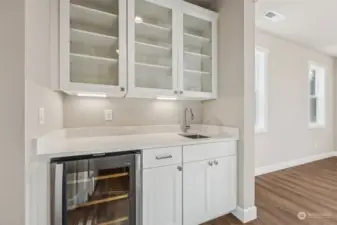 Butler's pantry between kitchen and dining space