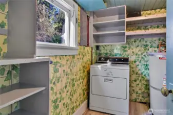 Laundry room, storage and water heater.