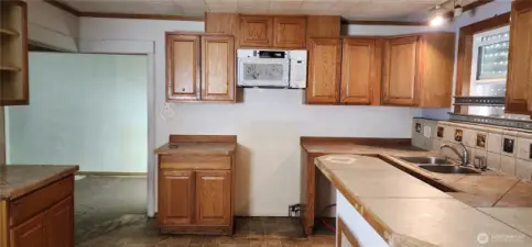 Kitchen, with dining room viewable off to the left
