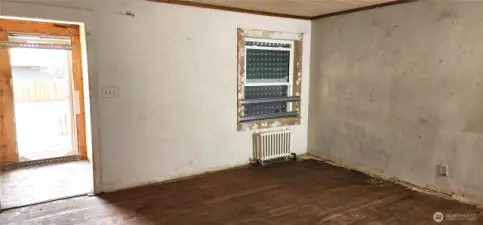Living room, with front door to the left