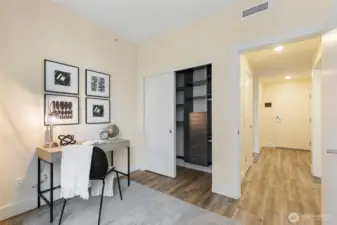 Custom closet system in guest bedroom