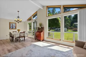 Looking into dining room and front yard from living room