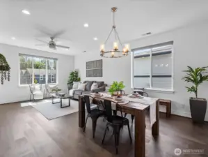 Handsome hardwoods, walls of windows, custom blinds greet you!
