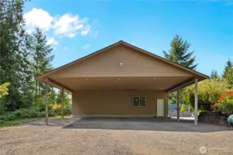 Huge carport for all of your toys or extra car parking