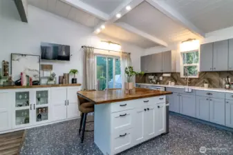 New tile floors and backsplash and plenty of cabinet space in the kitchen.