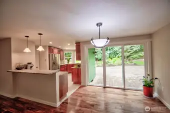 Dining area off kitchen with slider to back patio.