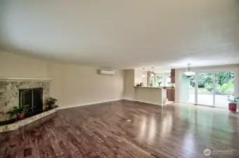 Large living room with gas fireplace and hardwood floors finished off this room beautifully!  This room is open to the dining area with sliders to the back patio and yard.