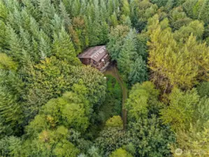 Home in the woods. Owner's current residence.