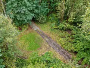 Partially paved driveway access to home. There is gated access to this driveway.
