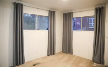 Bedroom two offers partial lake views, carpeting and closet.