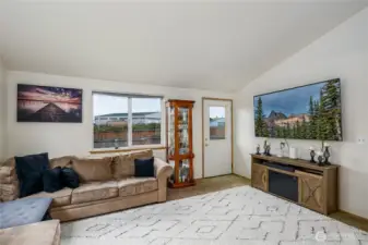 Large family room has access to the fenced backyard for grilling. No homes in back giving extra privacy.