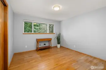 One of two additional main floor bedrooms - both have original hardwoods.