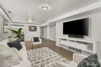 This room is another space that can (and has) accommodate a crowd. Beyond the conversation area is a large open space for your poker table or other games. Note that the carpet was replaced with luxury vinyl plank floors.