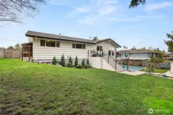 A look back toward your newly updated mid-century paradise. At the left end of the home you'll find two additional sheds for even more storage. Wouldn't you just love to make this home yours?