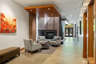 Welcoming lobby entrance with a sitting area and a gas fireplace.