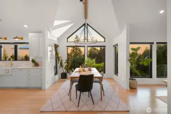 Step inside, and you'll be captivated by the soaring vaulted ceilings with exposed beams, adding a sense of grandeur and warmth to the living spaces.