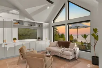 Featuring framed windows that showcase dazzling views of the bay and surrounding islands, the lounge is both stylish and functional, complete with built-ins and a TV for cozy movie nights or social gatherings.