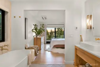 Inside, the ensuite is a haven of sophistication, featuring a spa-like atmosphere and a spacious walk-in closet with custom California Closets designed to keep everything impeccably organized.