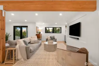 The suite also showcases exposed beams and wood floors, adding a touch of warmth and character to its modern design.