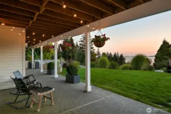 The covered patio itself is a showstopper, offering infinite bay and island views that set the stage for unforgettable evenings as the sun dips below the horizon. Whether you’re savoring a quiet moment or hosting loved ones, this outdoor haven is perfect for unwinding and soaking in nature’s beauty.