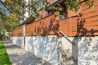 Private & Polished – A fenced entry offers simplicity with a modern edge.