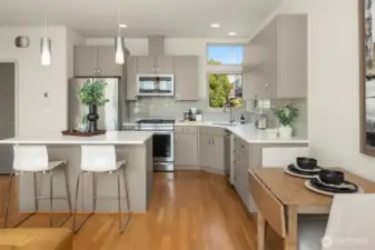 An airy, connected layout that blends cooking, dining, and gathering in style.