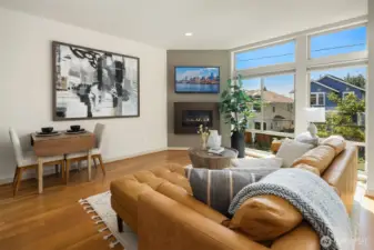 Light, Luxe, Living – Soaring windows, sleek fireplace, and a stage set for stylish gatherings.