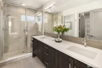 Spa-inspired design with a glass shower, double vanity, and clean modern finishes