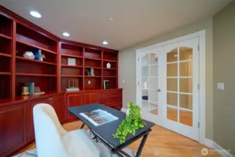Office with beautiful built-in bookcases and French doors. Could be 6th bedroom.