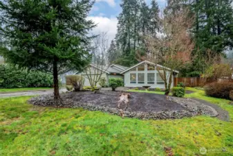 Tucked back off the quiet street with additional privacy via mature landscaping