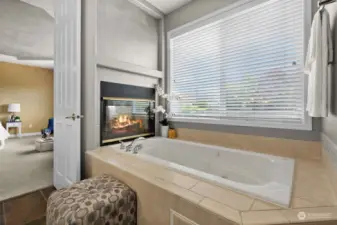 Primary Bath has room for TV above the fireplace